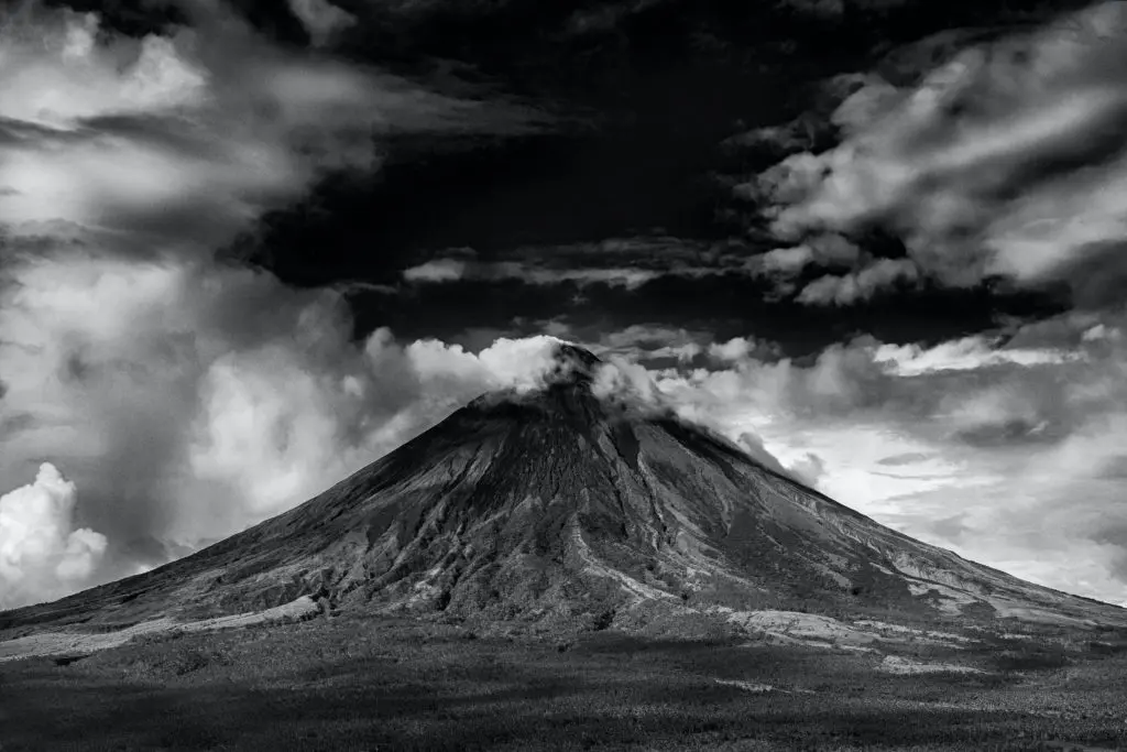 Dark sky over mountain in black and white