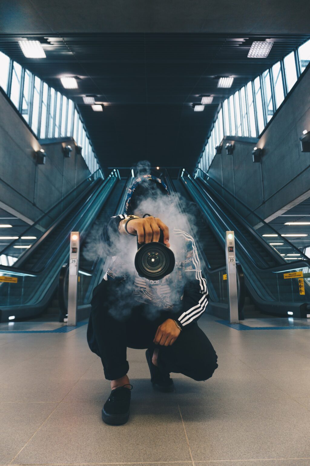 Man taking photos with a smoking camera 