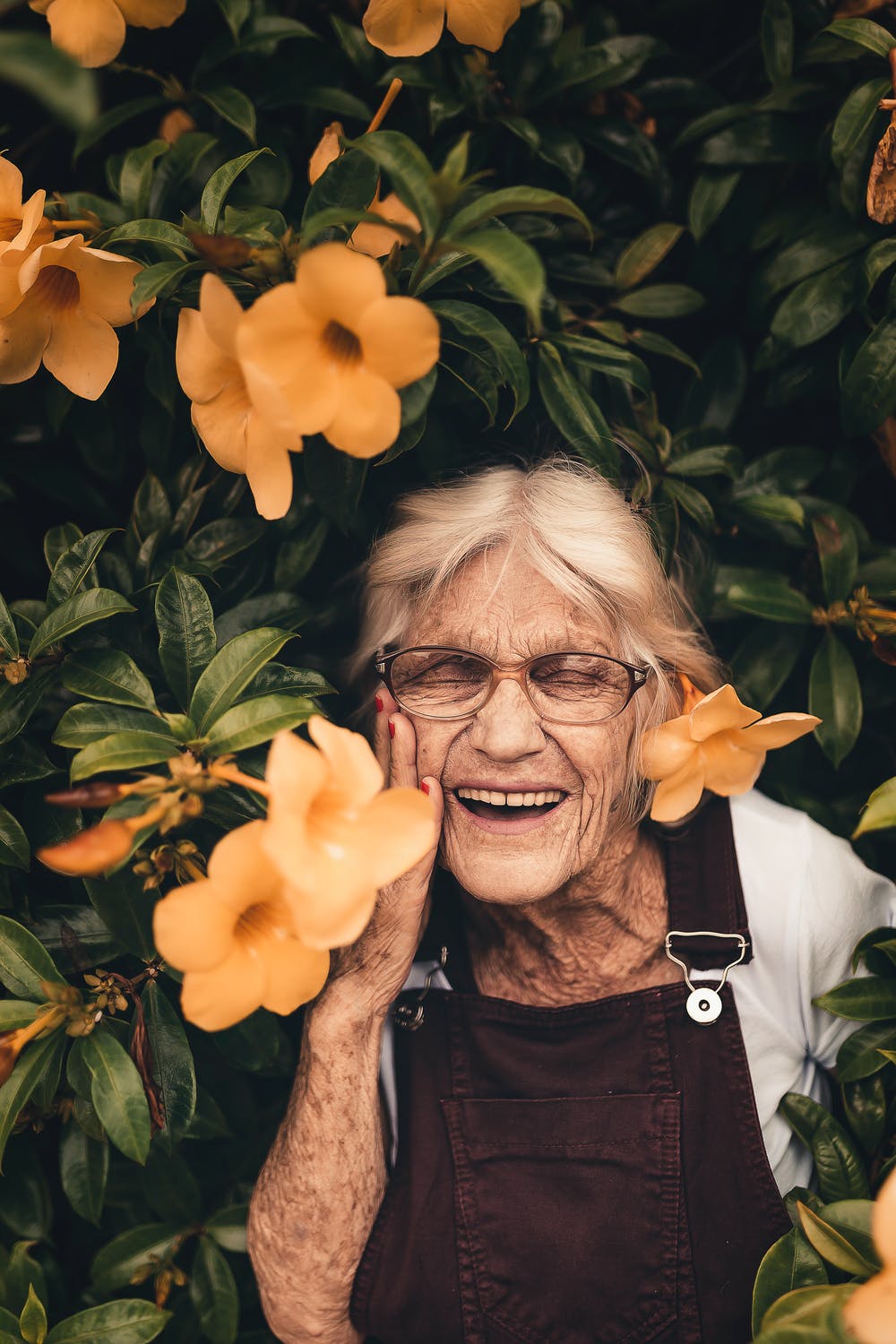 Lady in flowers happy