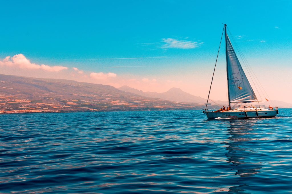 Yacht sailing on a tilted horizon