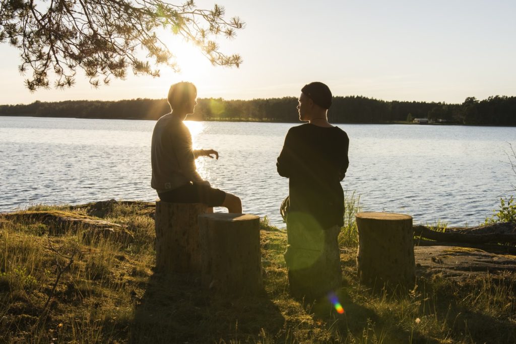 portrait by the lake with lens flare