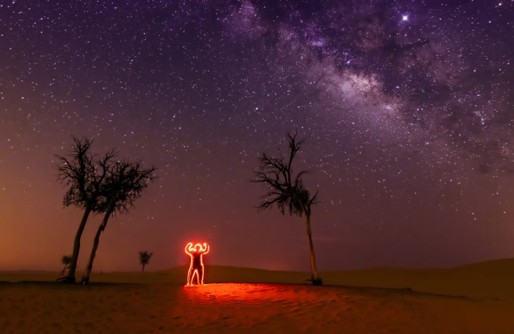 Milky Way with light painting in the foreground.