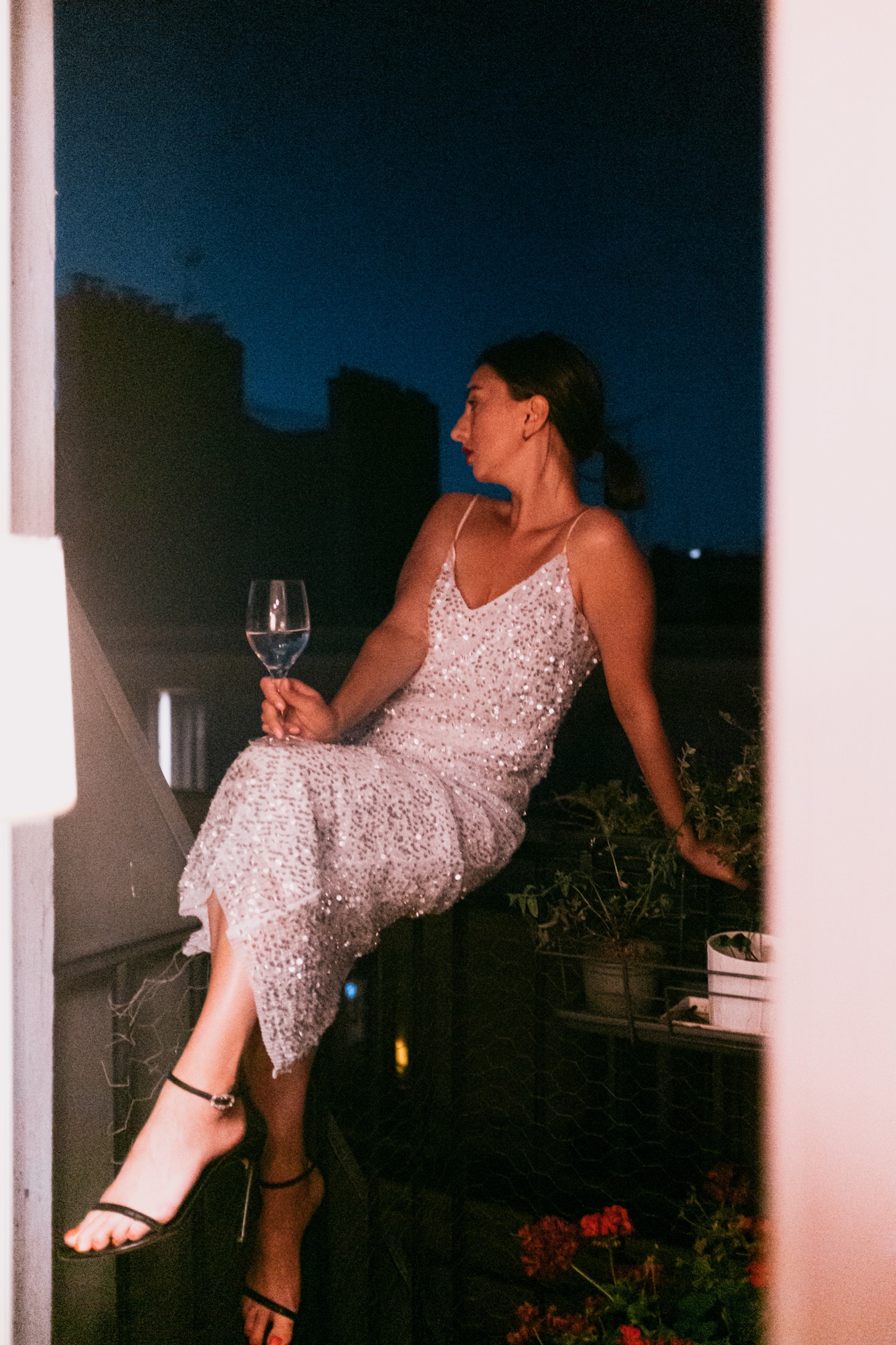 photo of woman holding wine glass