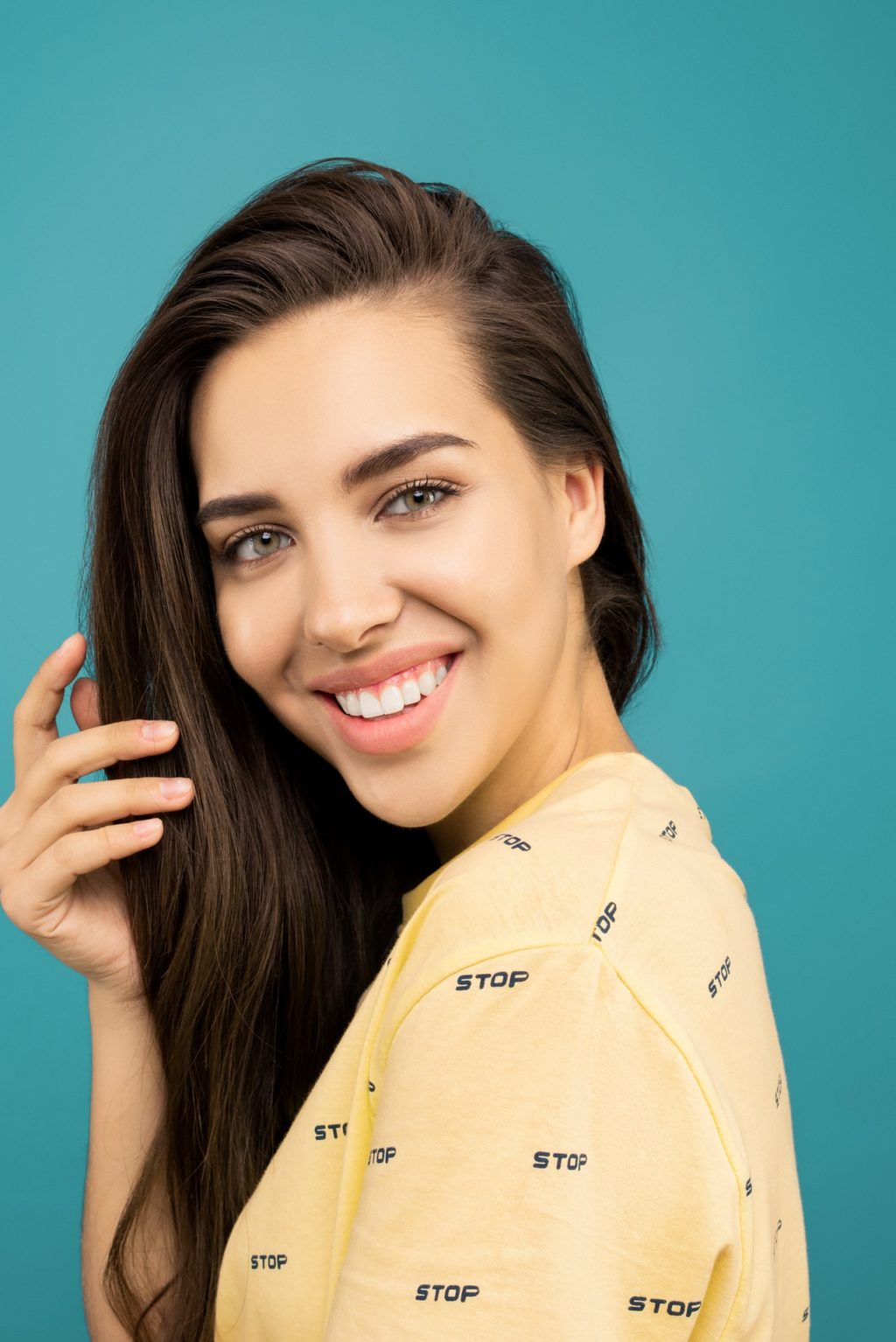 photo of woman wearing yellow shirt