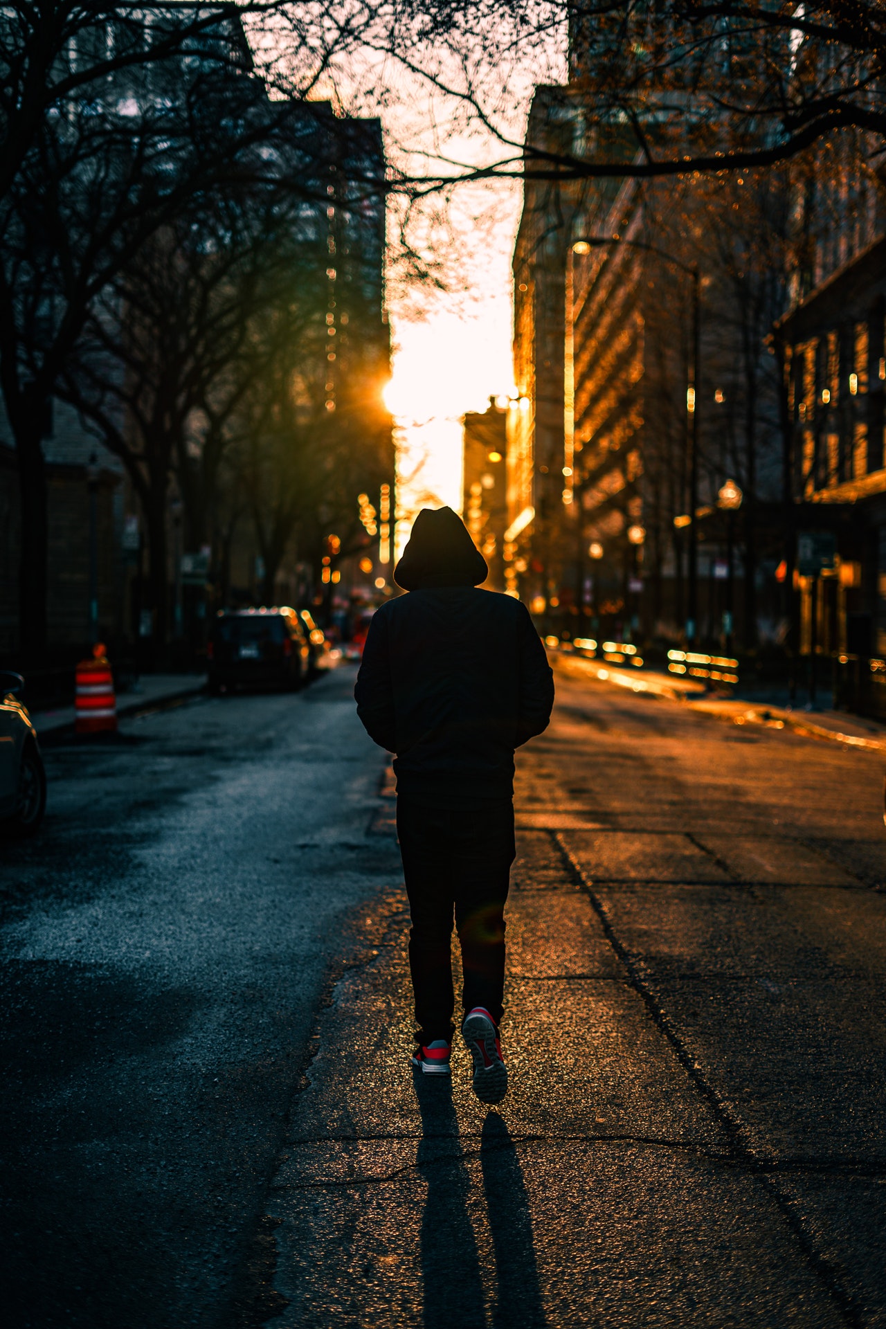photography of person walking on road