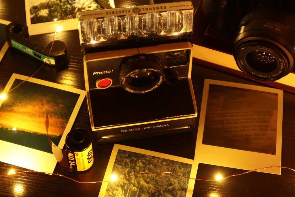 Vintage Polaroid camera and prints.