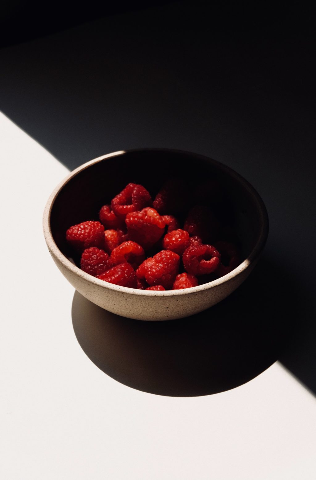 a bowl of raspberries