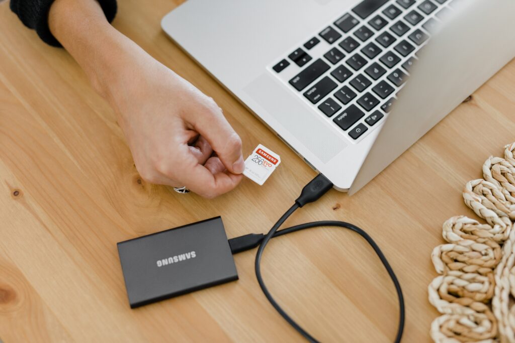 Apple laptop with SSD drive attached to it.