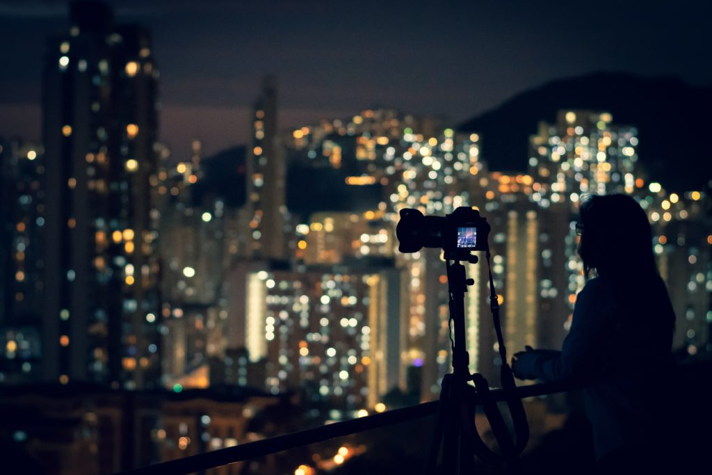 Photographer shooting Hong Kong at night 