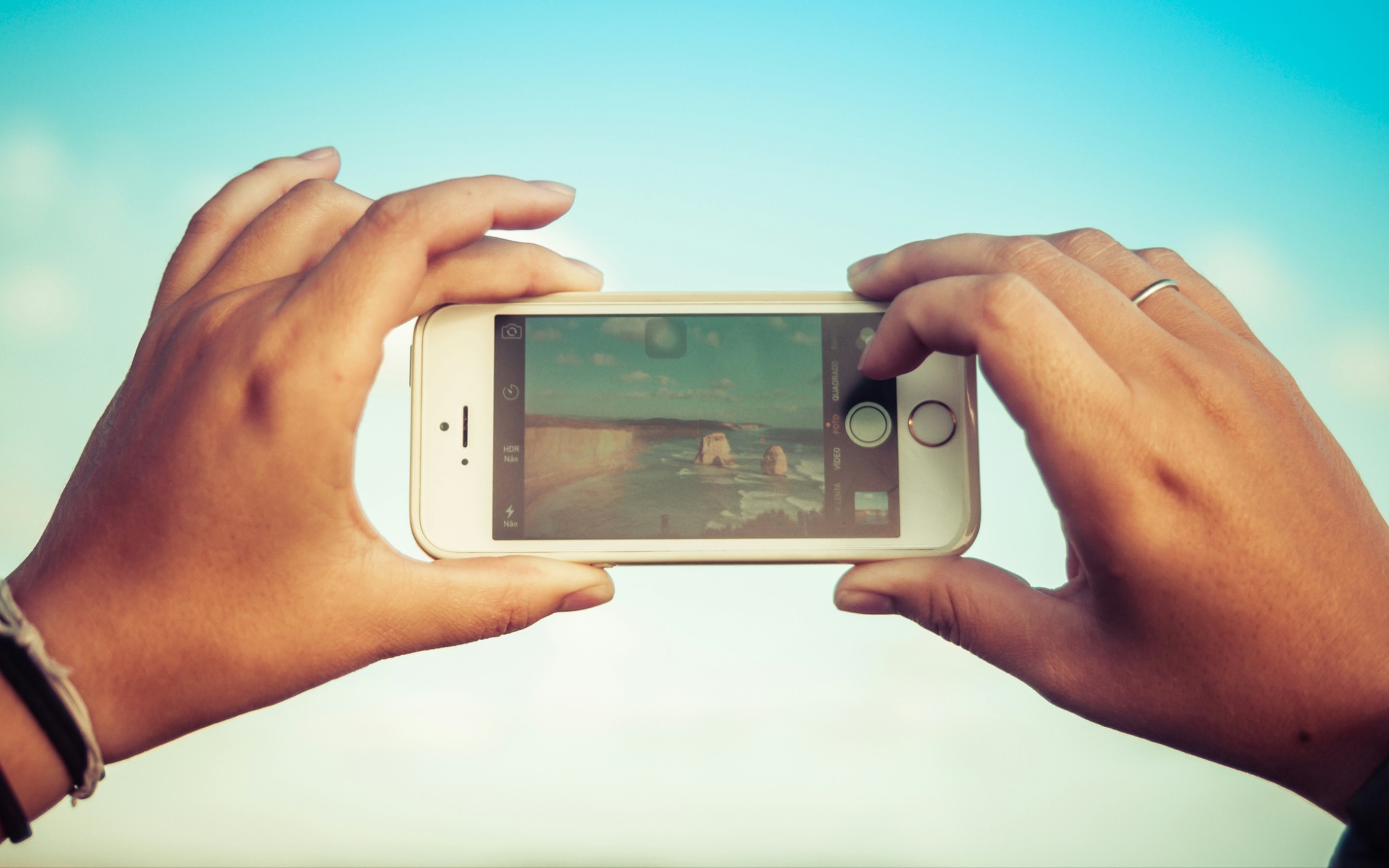 Someone taking a photo with an older smartphone