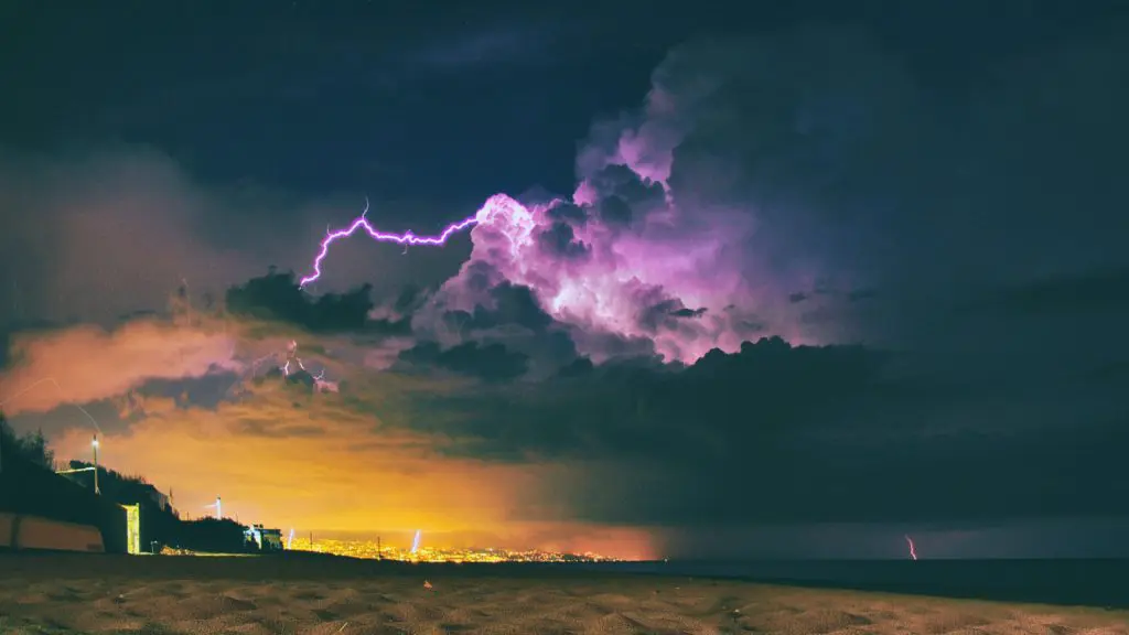 seashore under nimbus clouds