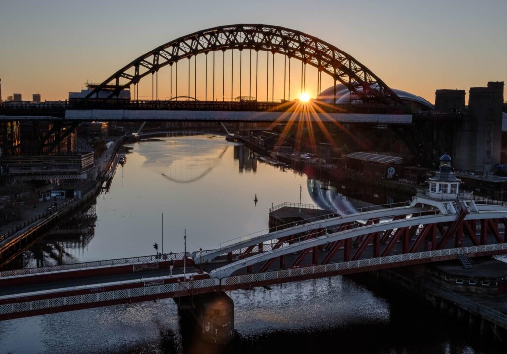 Sun rises behind the Tyne Bridges and Glasshouse in Newcastle and Gateshead