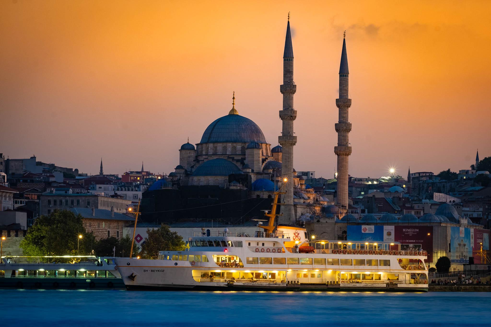 Sunset image of ferry and mosque in Istanbul, Turkey