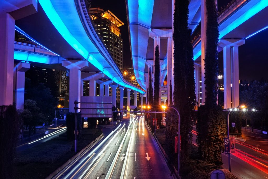 time lapse photo of vehicle on road during night