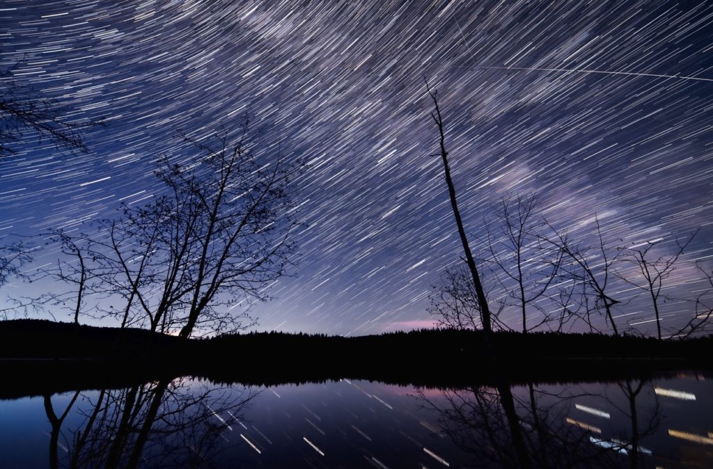 time lapse photography of body of water at nighttime