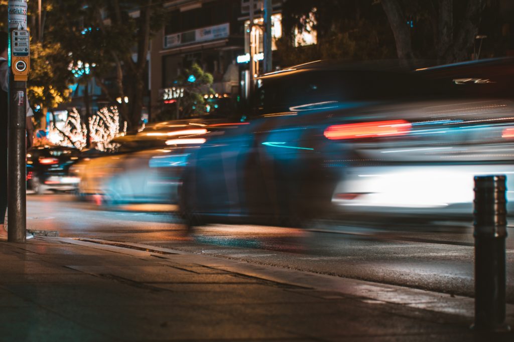 time lapse photography of silver car passed by on road