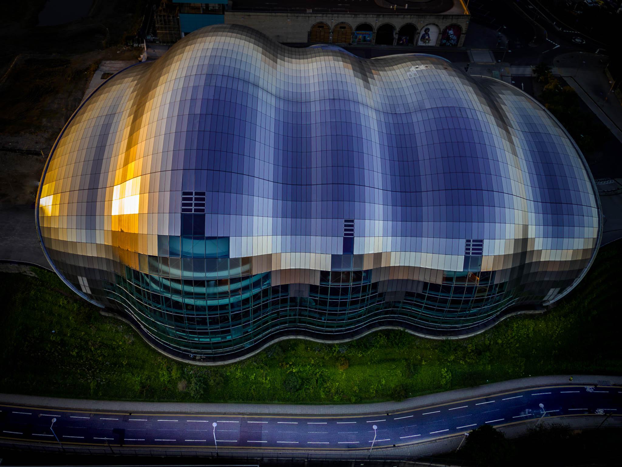 Top down aerial view of Sage centre in Gateshead England at dawn
