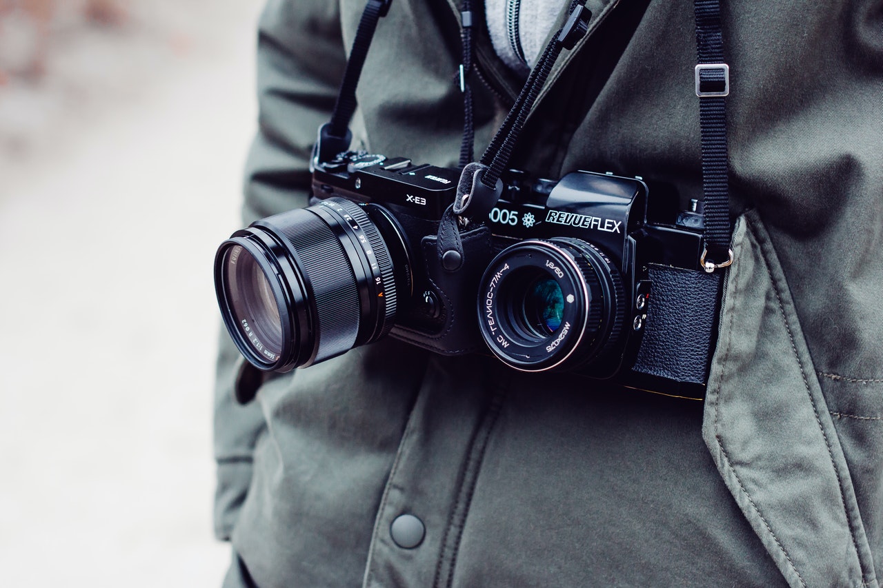 two black bridge and dslr cameras