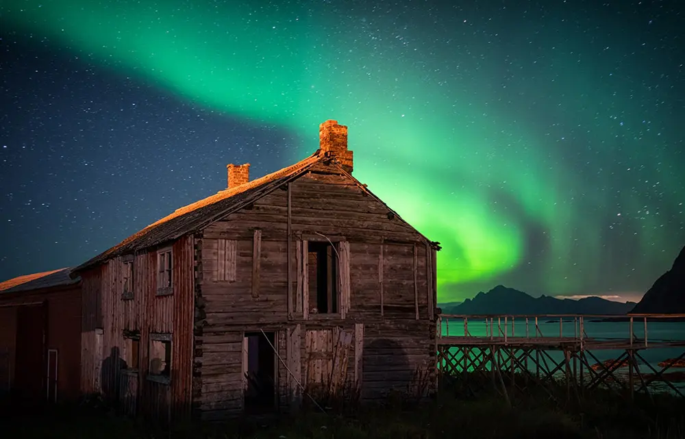 the aurora over an old shack