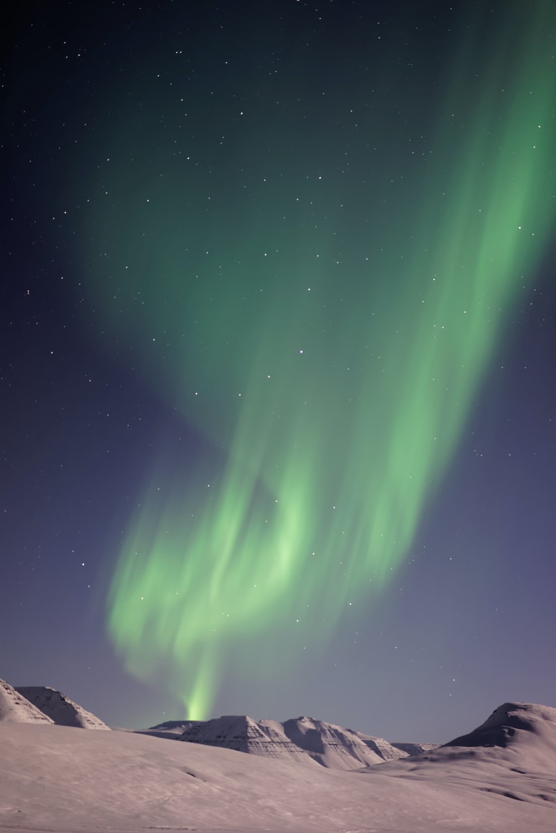 Aurora lights above mountain