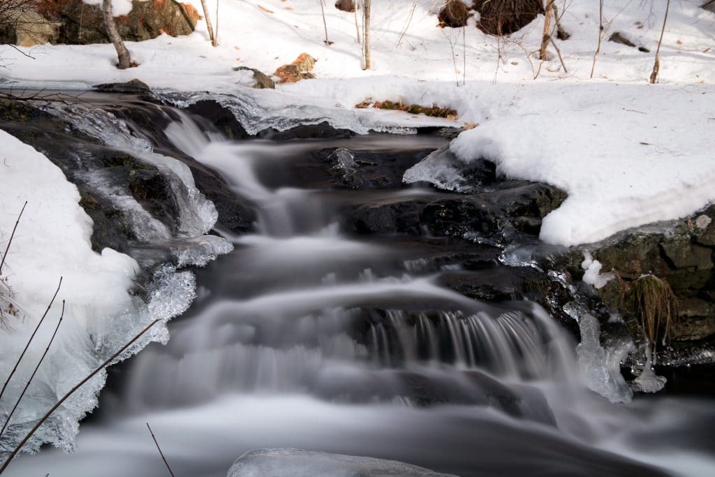 snow and ice with waterfall