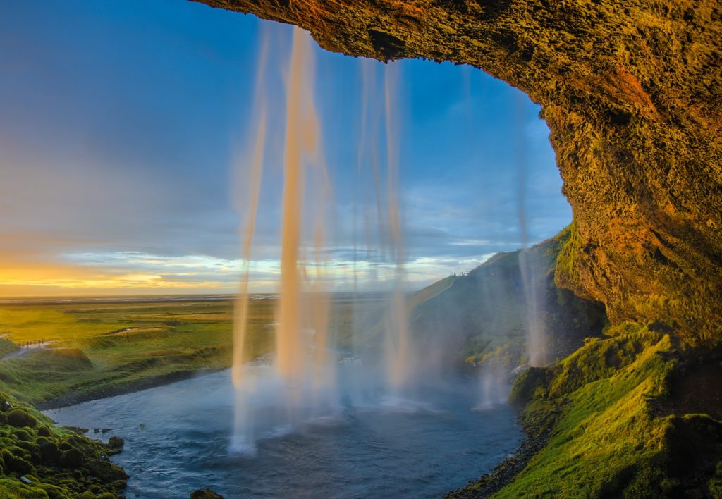 waterfalls under blue skies