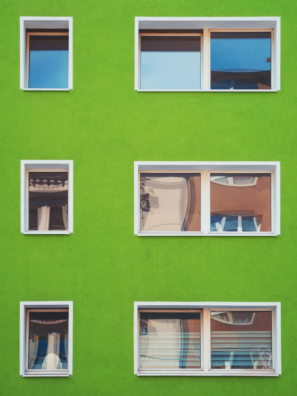 windows in a bright green wall