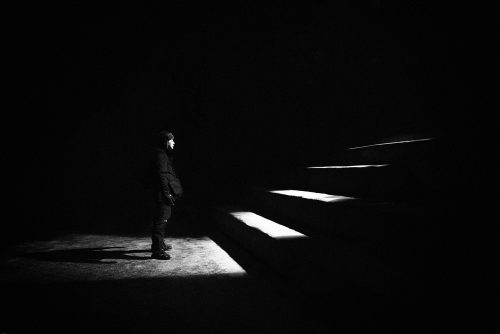a person standing in a dark room