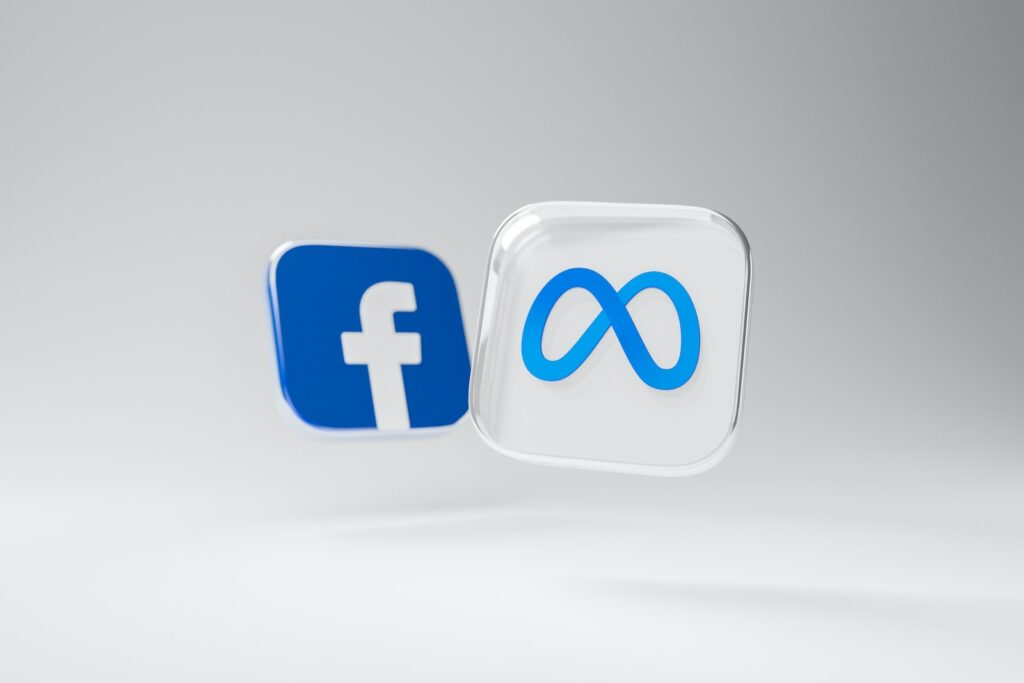 a white and blue square with the meta logo a blue and white facebook logo