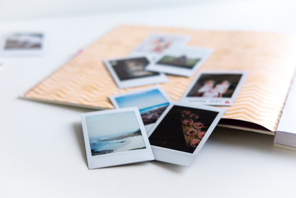 photos on white wooden table